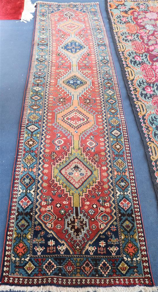 A Persian blue and russett runner, 325 x 77cm